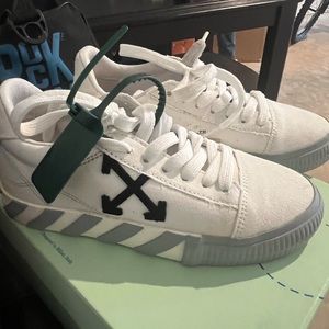 Off white canvas low top sneakers